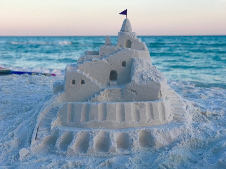 white sand castle at the beach