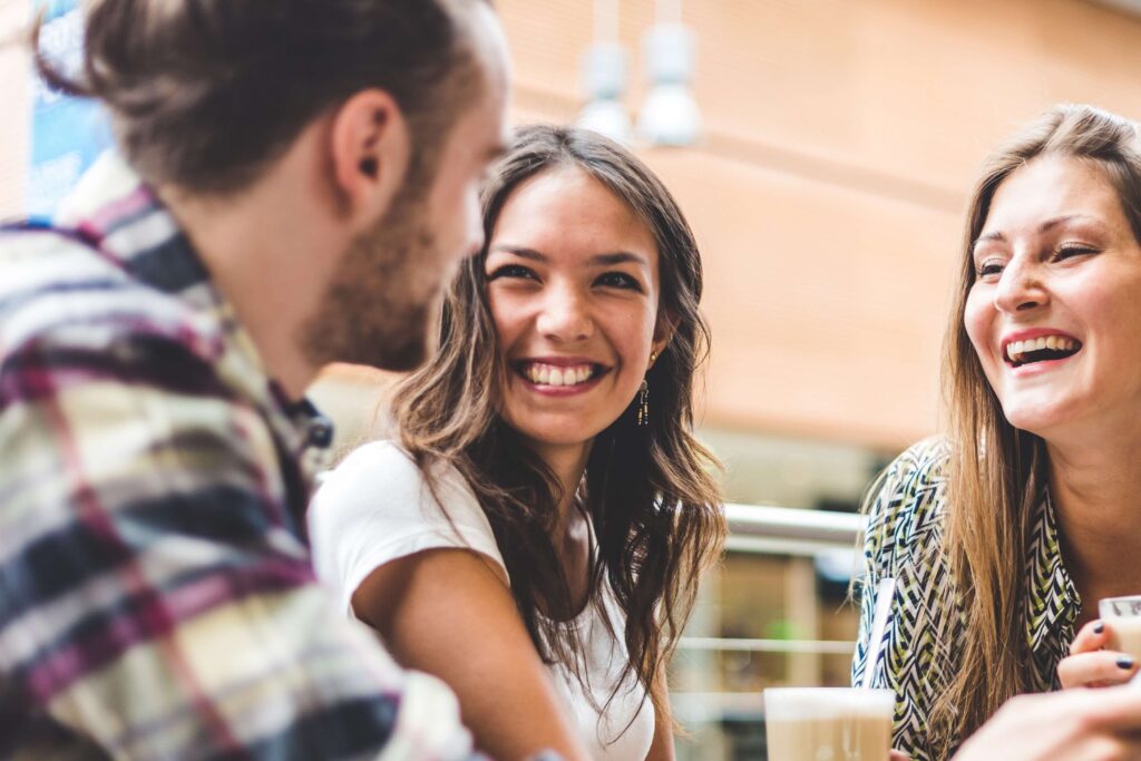 A group of friends enjoying Miramar Beach Restaurants.