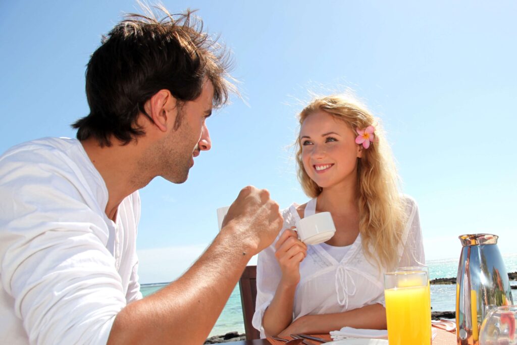 A man and a woman enjoying Breakfast on the 30A.