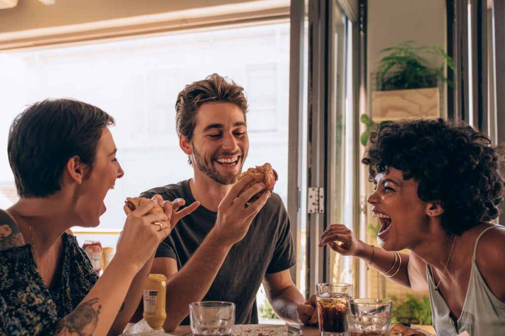 Three friends enjoying Destin Florida Restaurants.